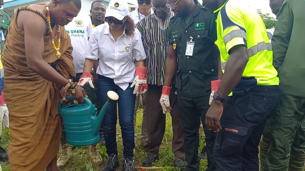 Ms Angela List (Director of Adamus Resources), local chiefs and forestry commission plant trees